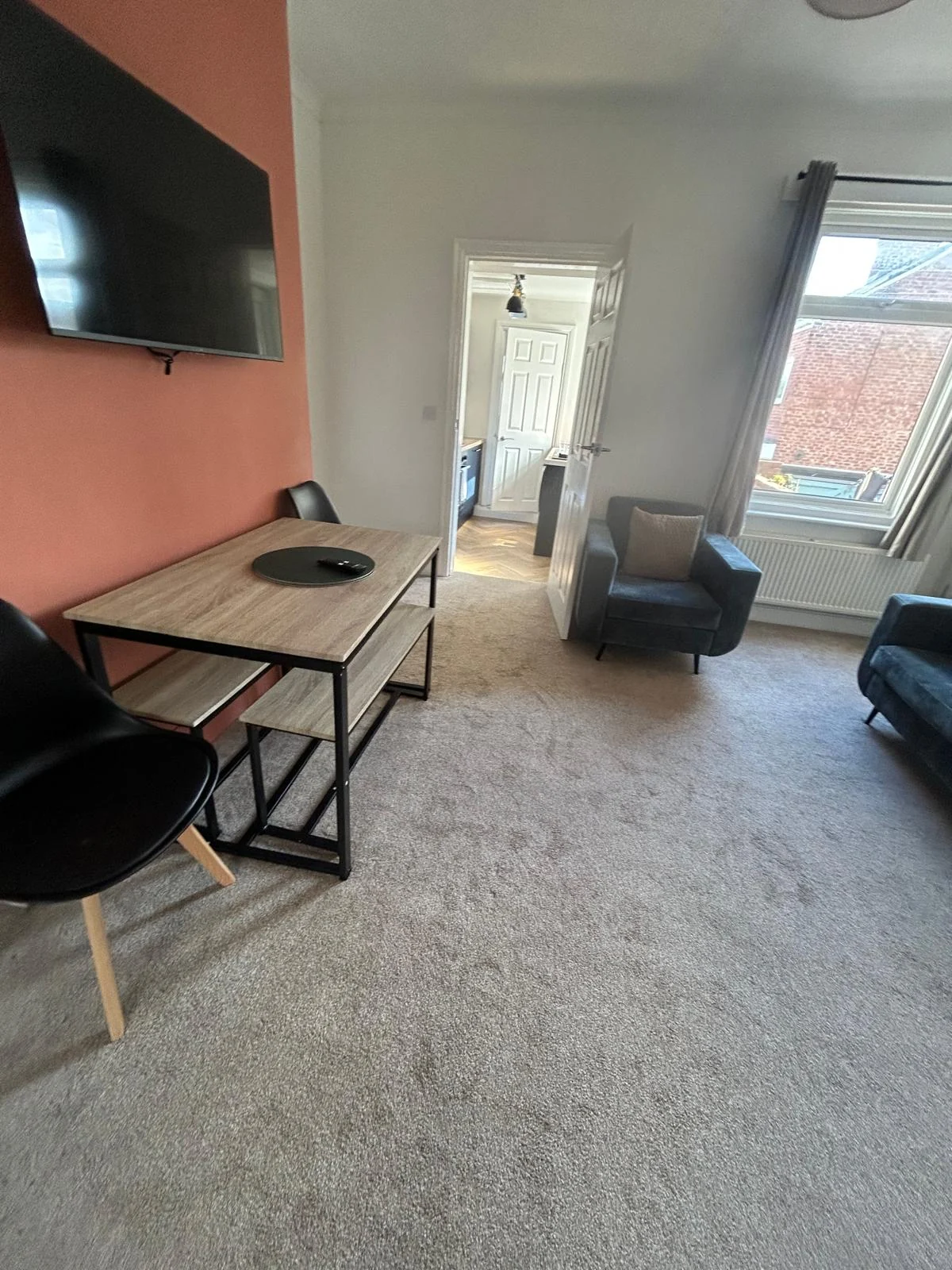 Cosy Quarters dining and lounge area prepared for guest arrival