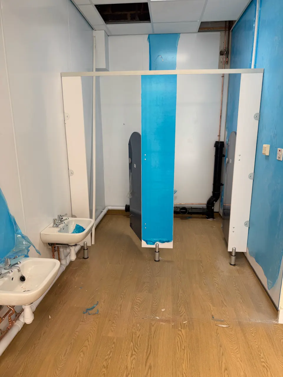 Washroom area during post-construction preparation before a builders clean