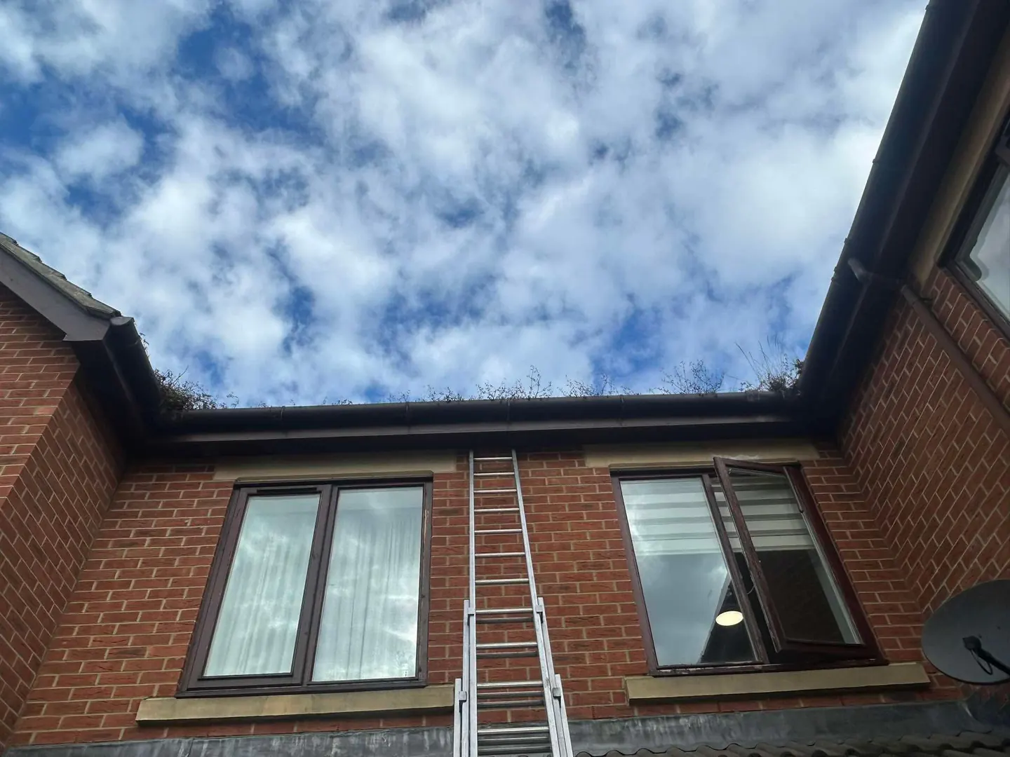 Gutter clearing access beside a brick care-home building