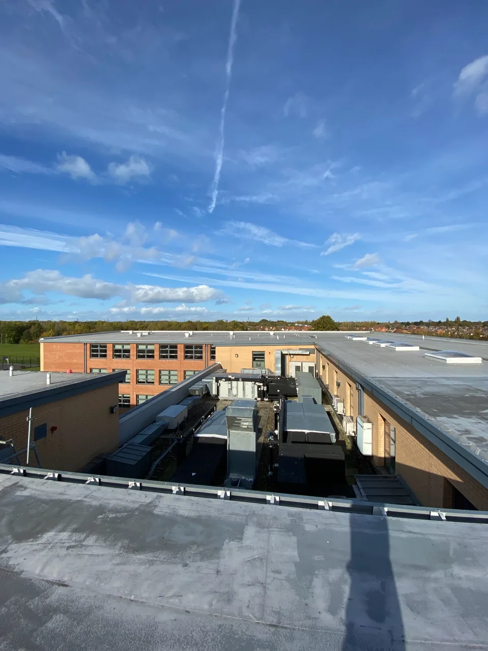 Commercial roof and plant area viewed during roof-cleaning work