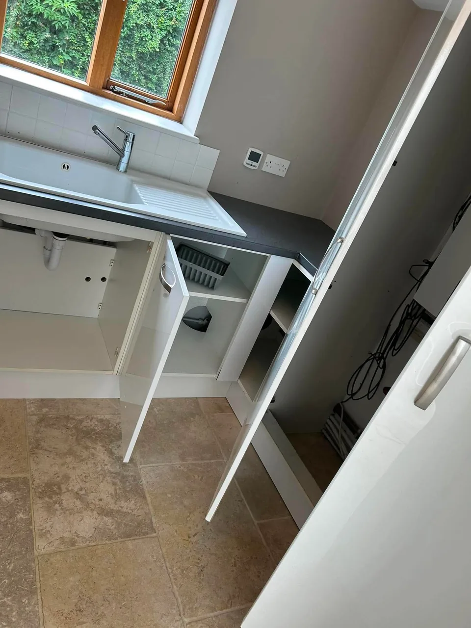 Domestic kitchen and utility space prepared during a detailed property clean