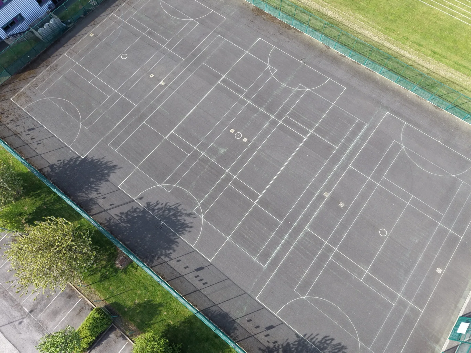 Aerial view of the Freebrough Academy tennis court during cleaning