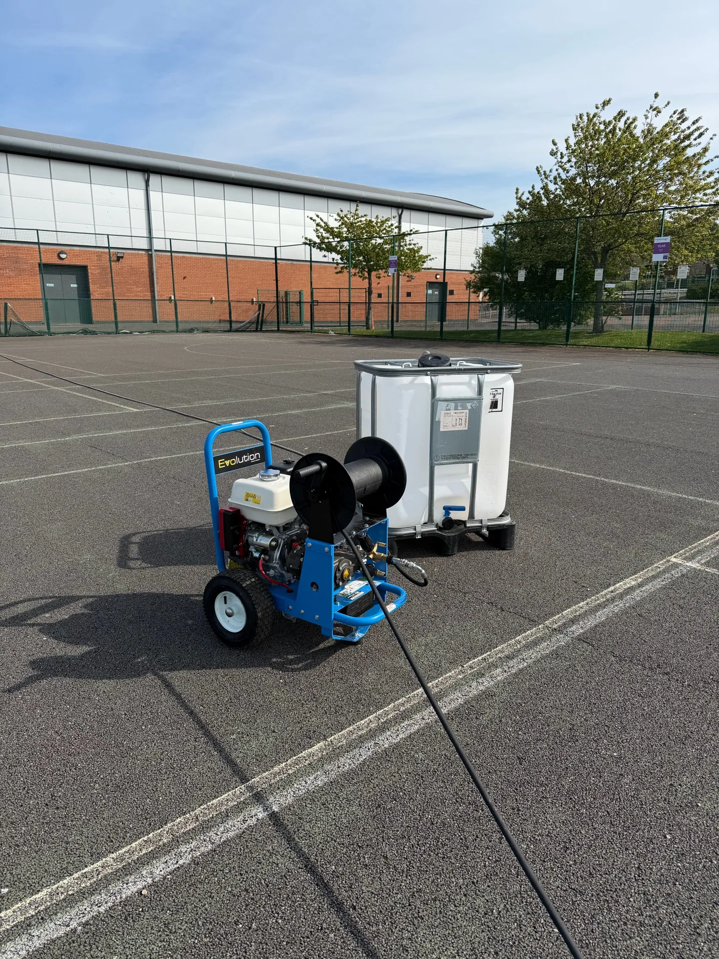 Freebrough Academy tennis-court cleaning equipment prepared before work