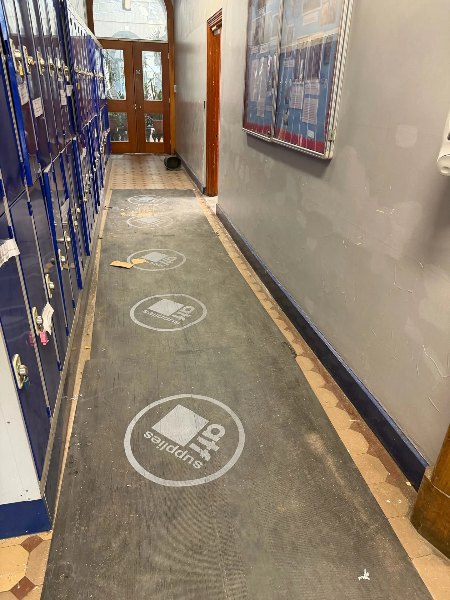 Pre-clean corridor condition at a Principal Project Management project