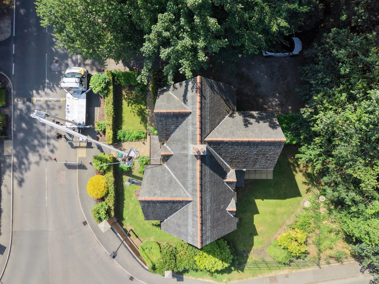 Overhead view of controlled roof-work activity and access arrangement.