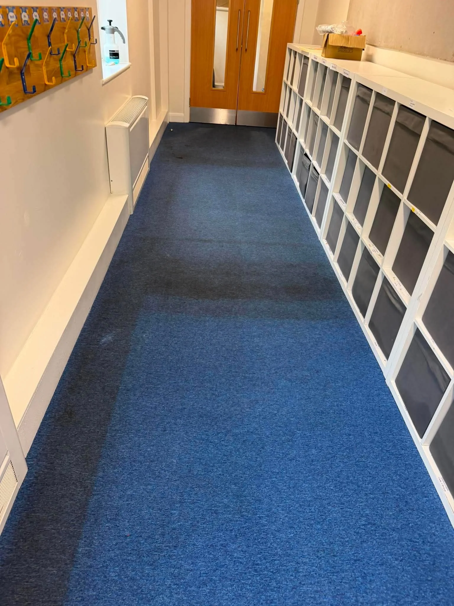 School corridor carpet shown after the agreed cleaning work