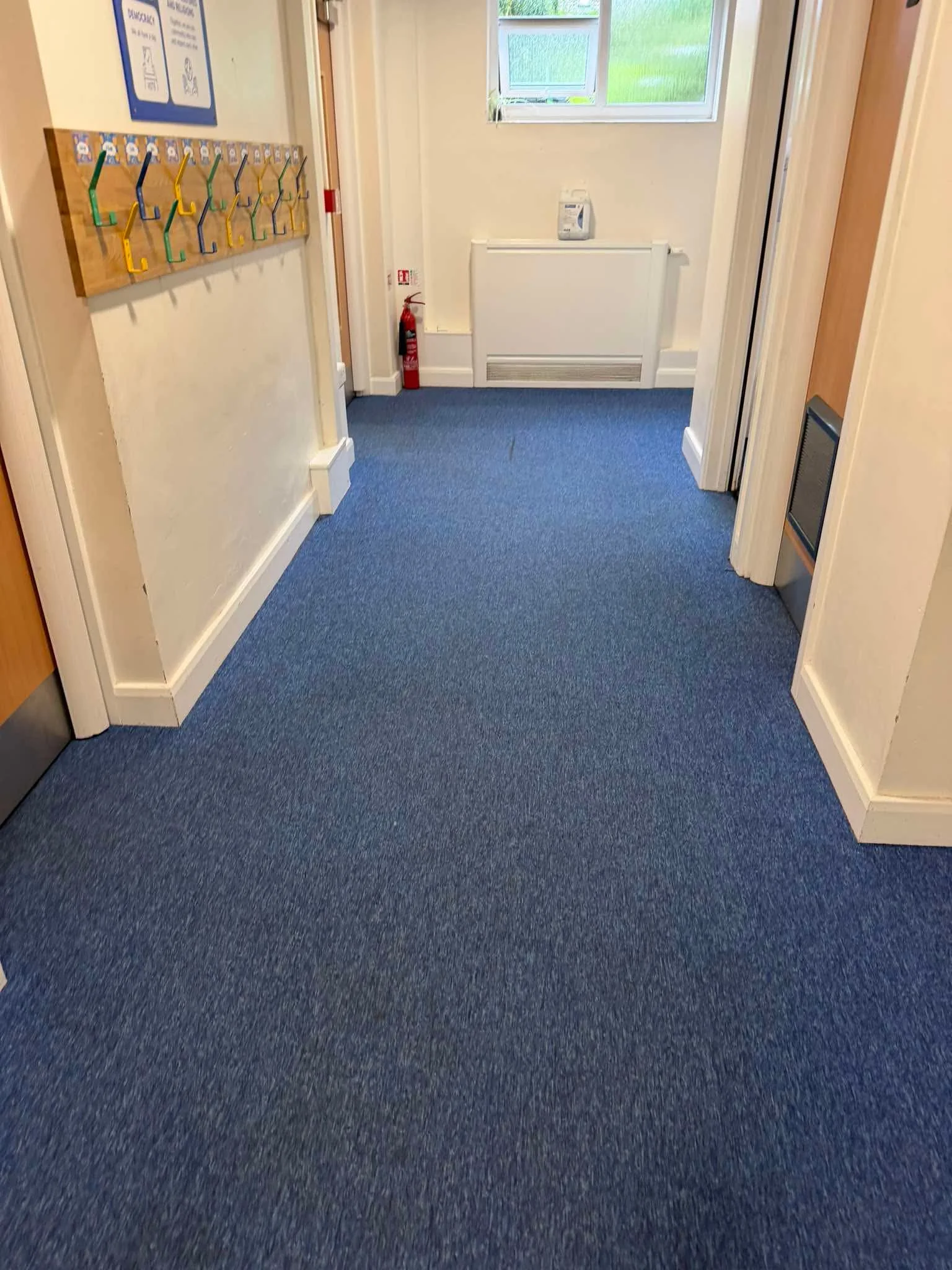 High-footfall school corridor carpet following the agreed cleaning work