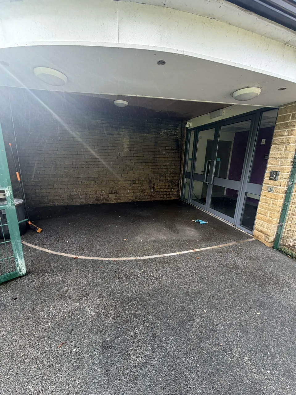Cleaned school entrance surface following a pressure-washing project