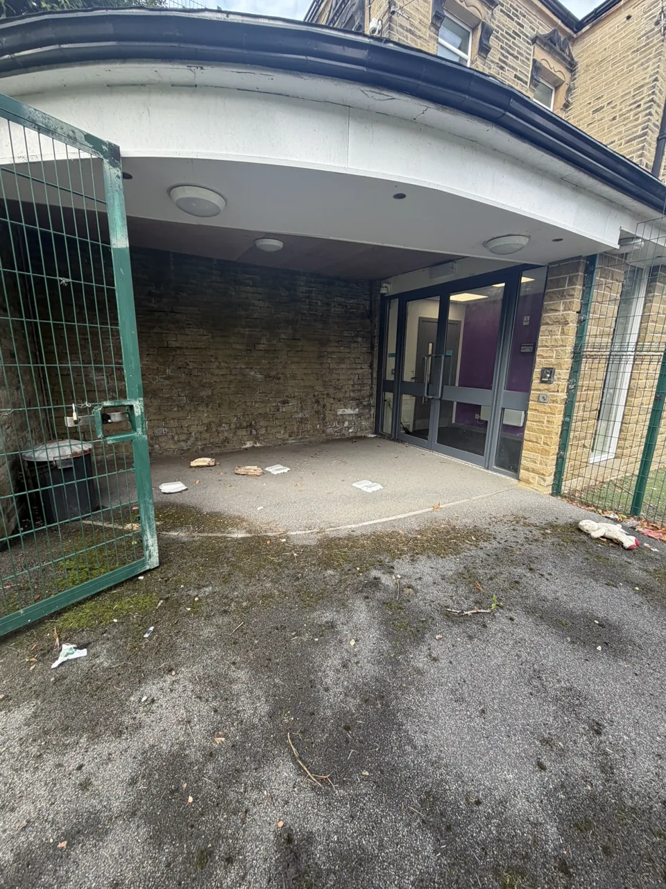 School entrance surface before pressure-washing work