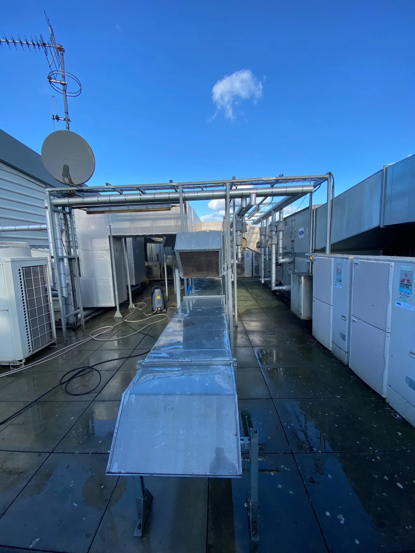Rooftop working area at a school roof-and-gully cleaning project