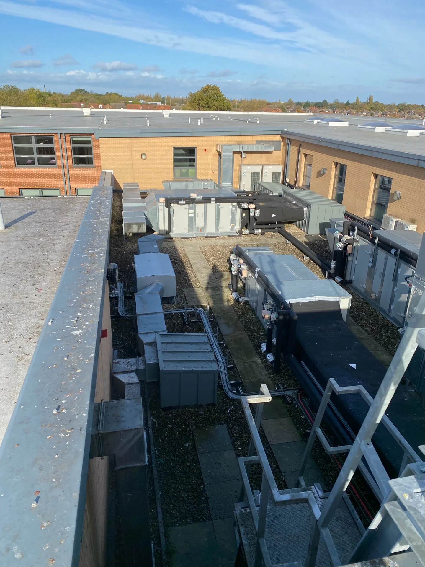 School roof and rooftop plant overview during the cleaning programme
